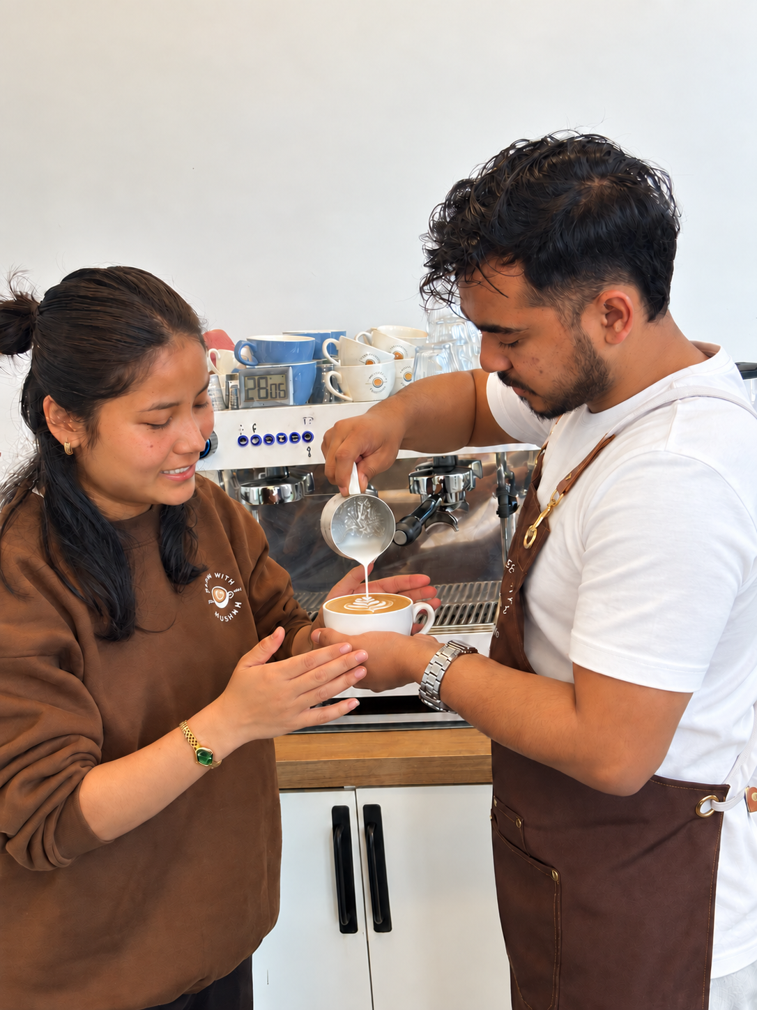 Hands-on latte art practice with guidance at Coffee With Muskan